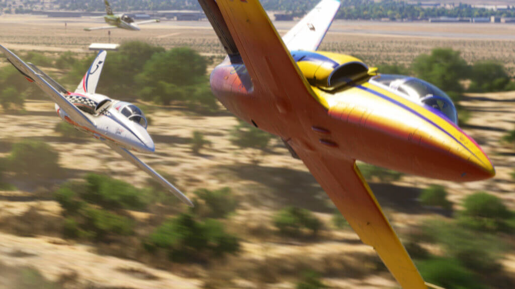 Official Microsoft Flight Simulator 2024 image showing two racing jets banking low over an air-race course
