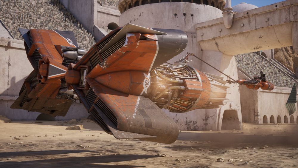 An orange podracer beside a crowded arena in Star Wars: Galactic Racer.