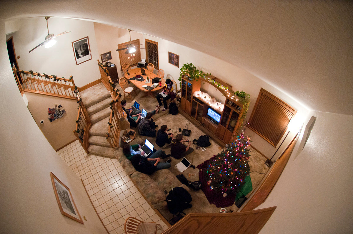 Players gathered around PlayStation 3 consoles during a local LAN party