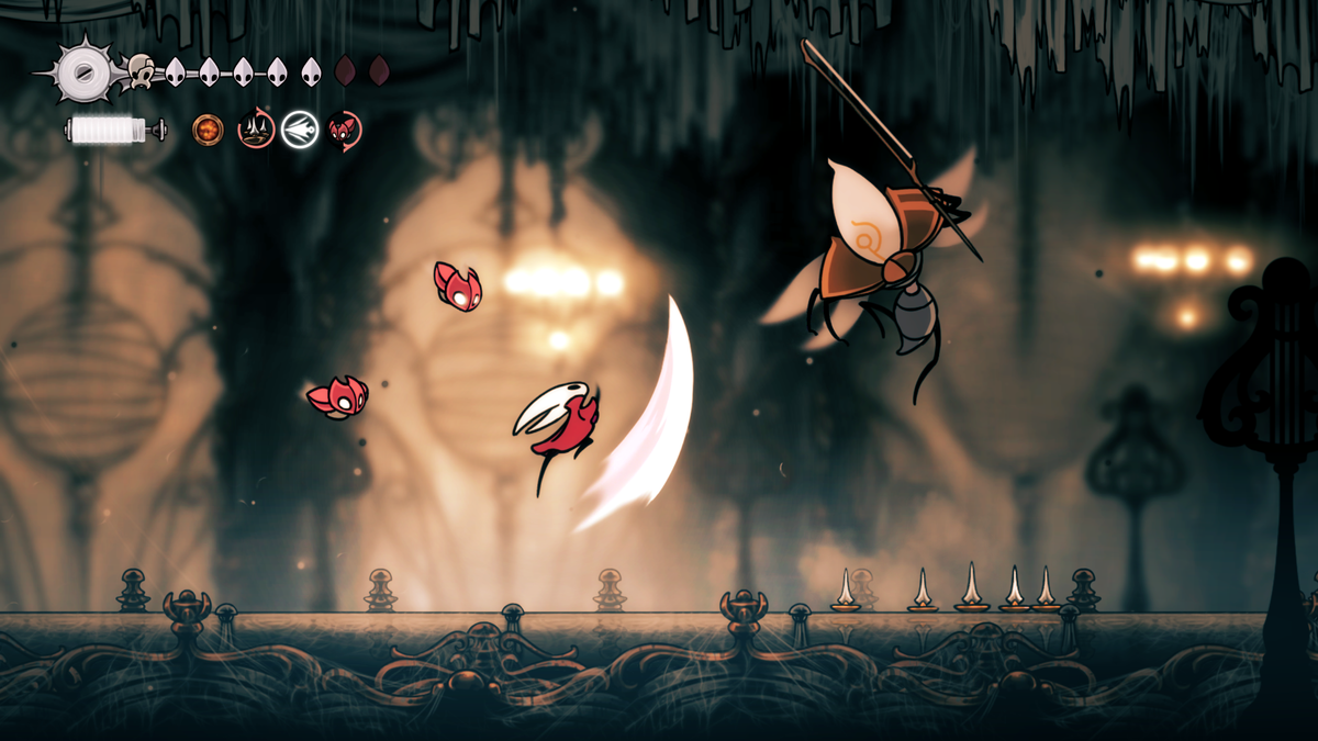 Hornet swings her needle toward an airborne enemy in Hollow Knight: Silksong.