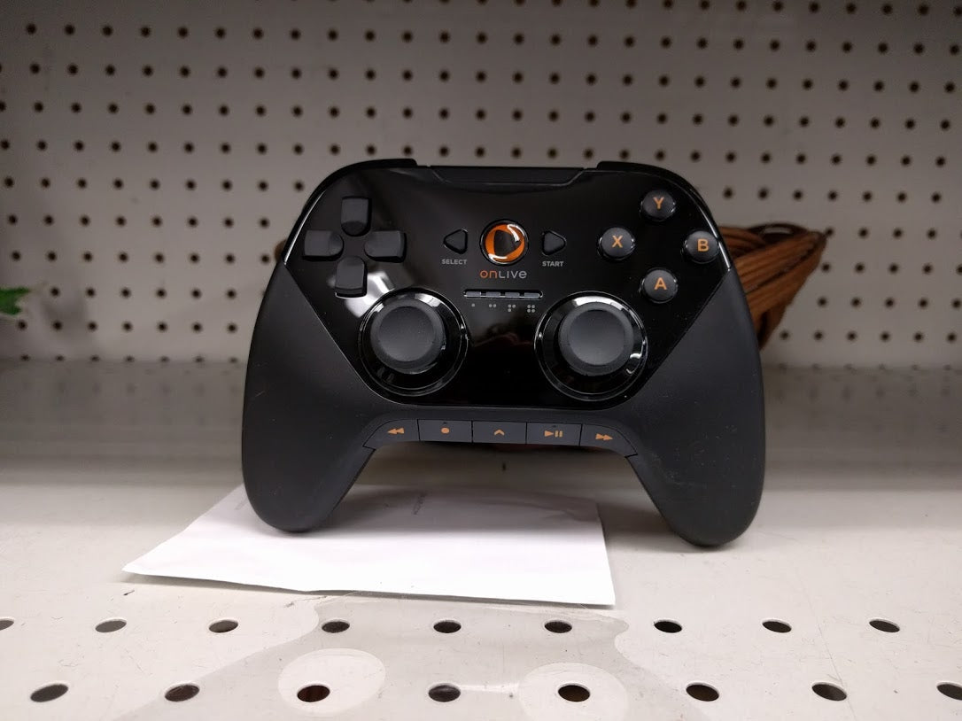 Black OnLive wireless controller with an orange OnLive button and playback controls