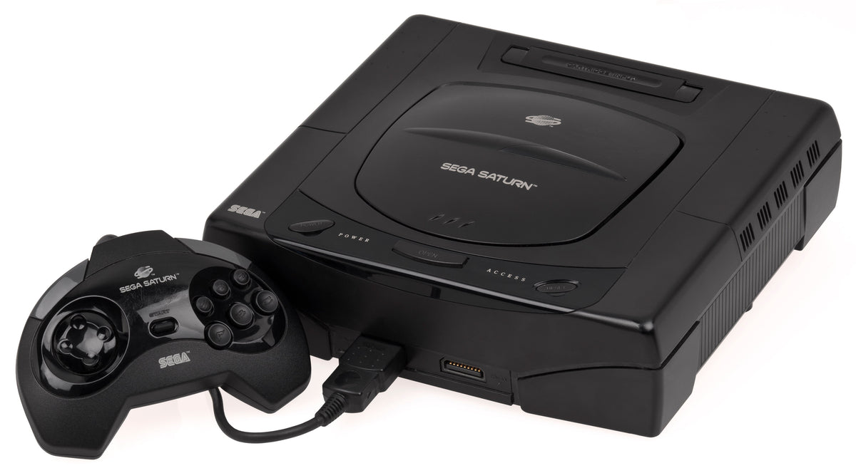 First-model US Sega Saturn with oval buttons and its original controller