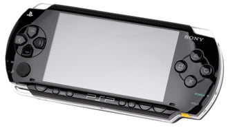 Black original-model Sony PSP showing its blank screen, analog control and face buttons