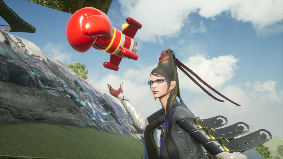 Bayonetta reaches toward a red boxing glove item in Sonic Racing: CrossWorlds