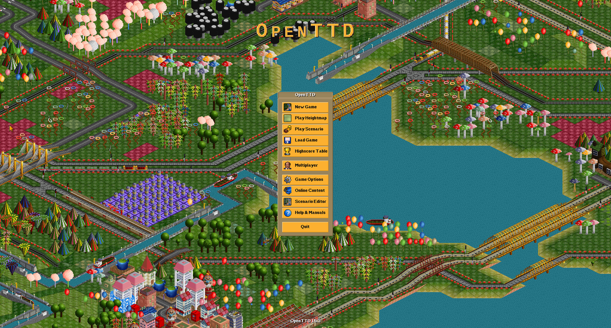 OpenTTD 15.3 gameplay showing a dense city connected by rail, roads, water and bridges