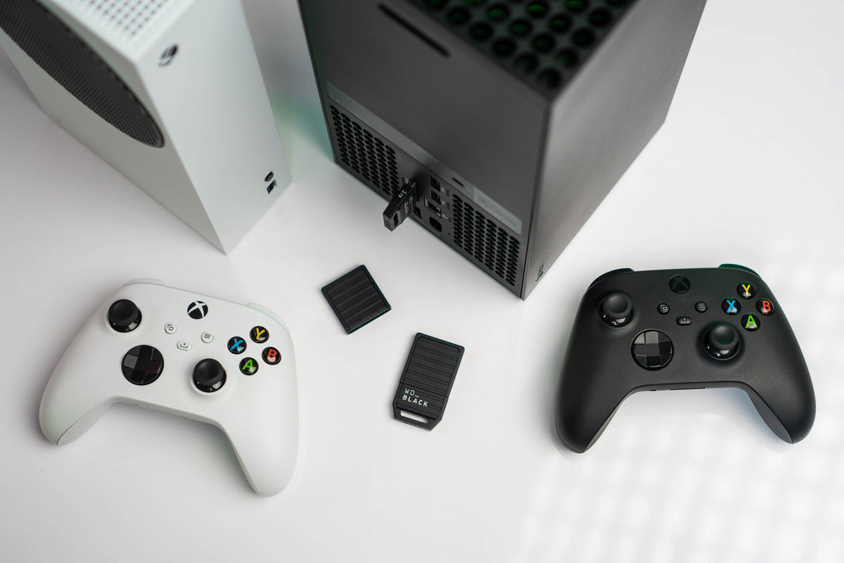 Xbox Series S and Series X consoles with controllers and WD_BLACK C50 expansion cards