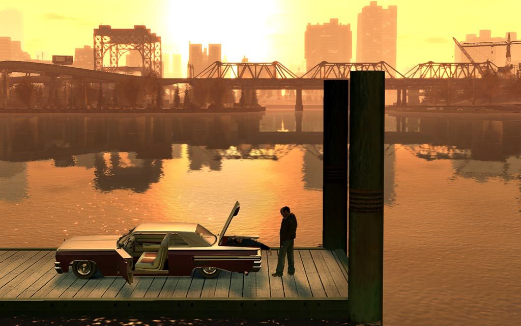 A car beside Liberty City's waterfront at sunset in Grand Theft Auto IV