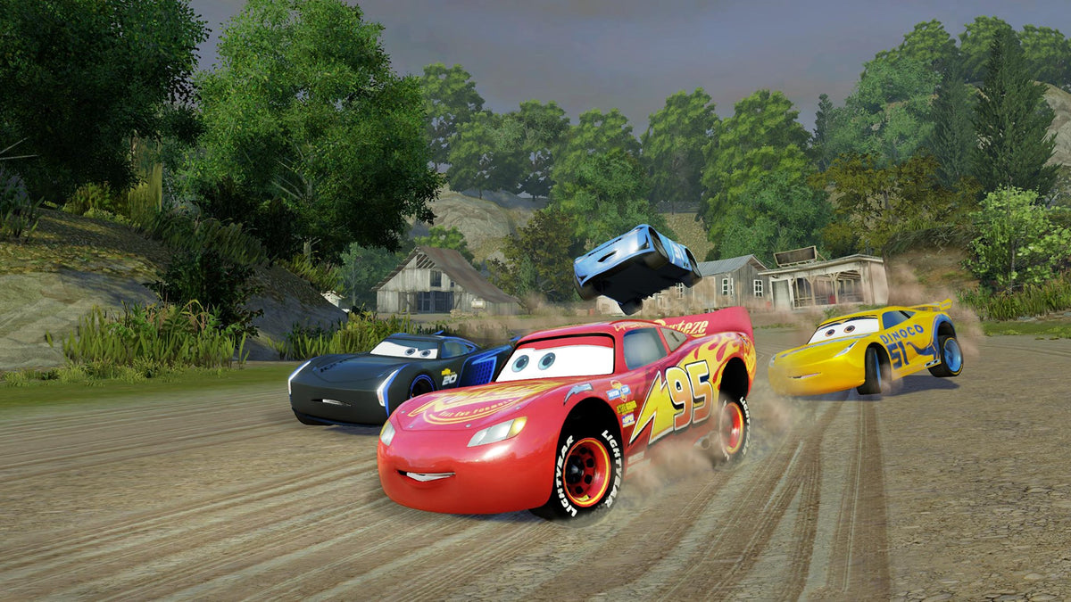 Cars 3: Driven to Win | Xbox One | gameplay screenshot | Racing and jumping on a dirt track | source=official Xbox BZKS084ZSXJ4 | asset=a5a76338-82c4-4e8a-b53c-004f3edbd64d