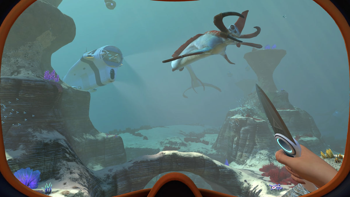 Subnautica gameplay screenshot facing a Reaper leviathan beside a Seamoth — official PlayStation Blog image